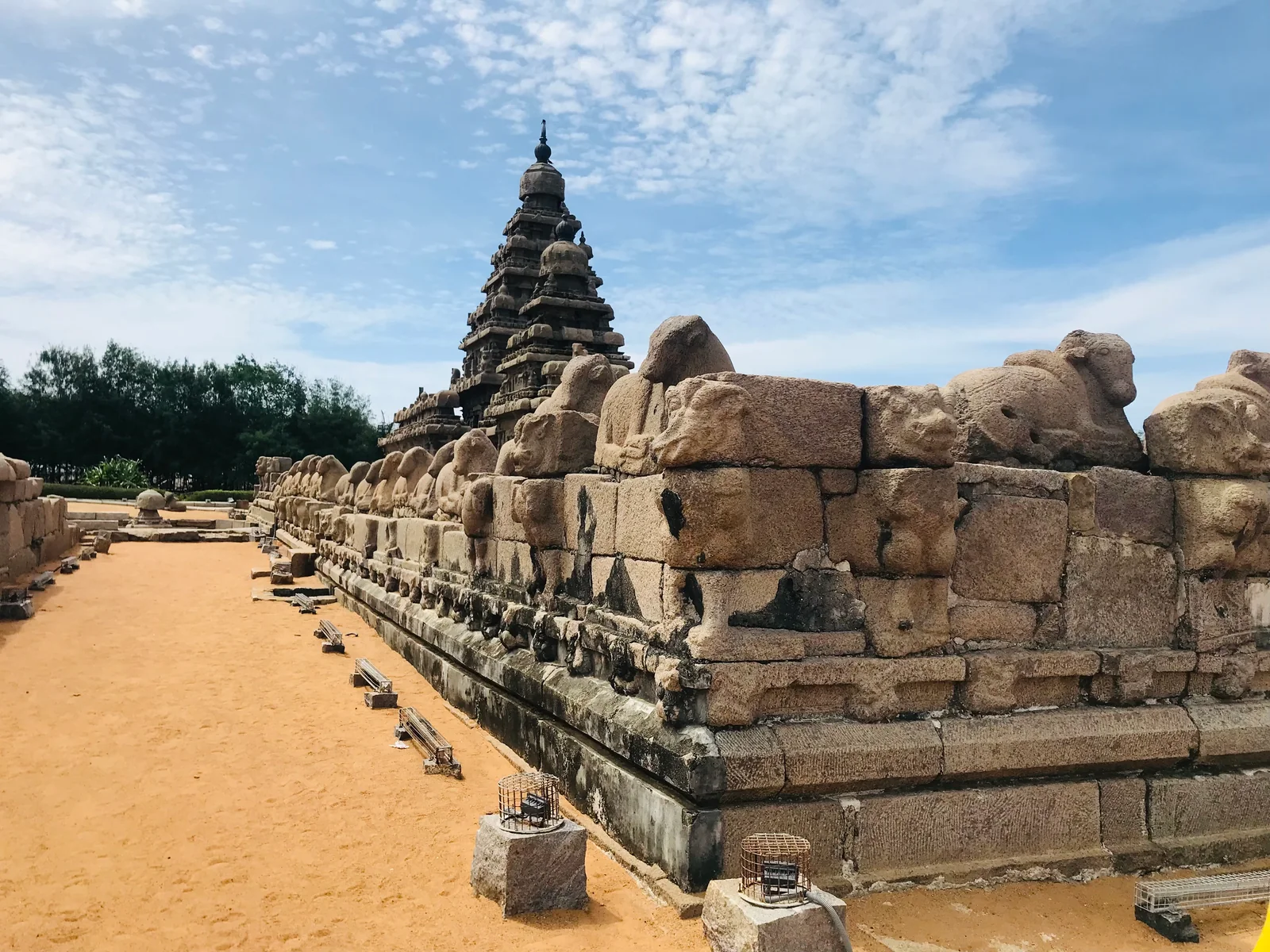 A carved stone Nandi in the foreground of the Shore Temple at Mamallapuram